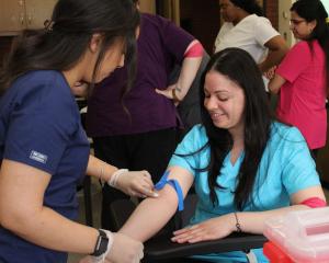 phlebotomy students practicing 